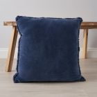 Camille Cushion, Navy by small coffee table