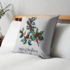 Christmas Holly Print Cushion, Natural on bed