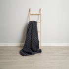 Chunky Cable Knit Throw, Grey draped on ladder