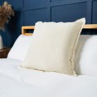 Cotton Cushion with Frayed Edge, Cream Styled on Bed