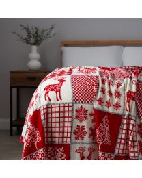 Christmas Winter Patchwork Throw, Red and White on bed