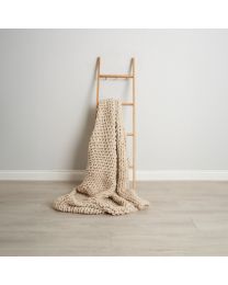 Chunky Cable Knit Throw, Cream draped on ladder