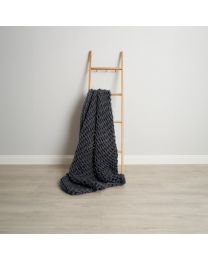 Chunky Cable Knit Throw, Grey draped on ladder