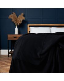 Jumbo Snugglie Fleece Throw, Black Styled on Bed