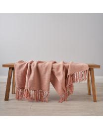 Juna Throw, Pink draped on coffee table