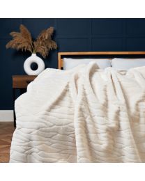 Luxury Embossed Rabbit Faux Fur Throw, Cream Styled on Bed