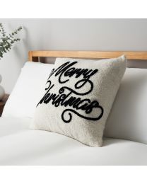 Merry Christmas Tufted Cushion, Natural on bed