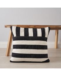 Tino Cushion, Black by coffee table